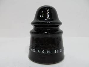 lot 17 image: Antique A.G.M. CD 423 SB Dark Amber Glass Insulator