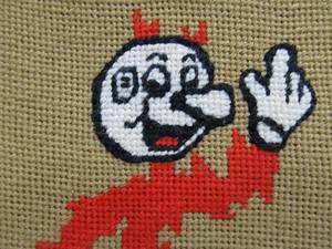 lot 176 image: Vintage Reddy Kilowatt Character Needlepoint