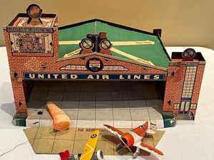 lot 56 image: Vintage Cardboard United Airlines Toy with Two Planes
