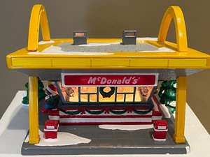 lot 54 image: Department 56 Snow Village McDonalds and Figurines