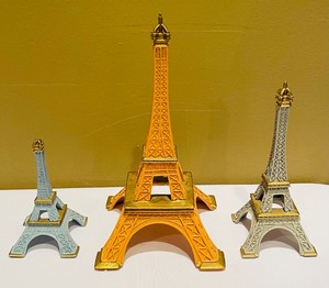 lot 142 image: Three Decorative Metal Eiffel Tower Figurines