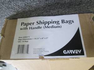 case of paper shipping bags with ha...