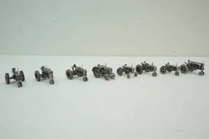 lot 204 image: Pewter Miniature tractors