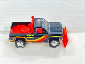 lot 66 image: Hot Wheels Henrys Hauling Power Plower with White Hubs