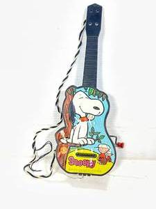 lot 85 image: 1950s Snoopy Wind Up Musical Guitar 14 Inches