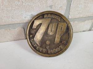 lot 400 image: 1930s 7-UP Bronze Safety Sidewalk Marker