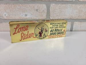 lot 449 image: Vintage Lone Rider Repeating Roll Paper Caps - Box is Full