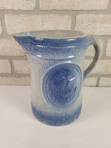 lot 462 image: A.E. HULL Salt Glaze Blue & White Stoneware Pitcher - Cows Grazing