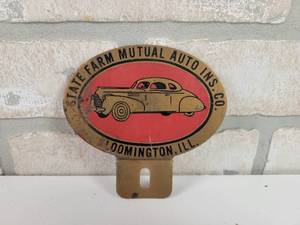 lot 485 image: Vintage State Farm Mutual Insurance Co. Metal License Plate Topper