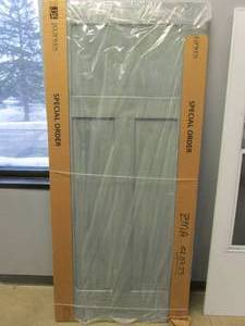 lot 181 image: JELD-WEN 36 in. x 80 in. DesignGlide Craftsman Stone Stained Molded Composite MDF Barn Door Slab (SCRATCHES ON THE DOOR, SEE PHOTOS)