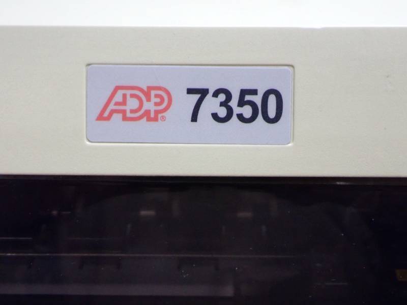 lot 30 image: ADP Accel 7350 Dot-Matrix Printer  Access Door is CrackedBroken  Power Tested On  Inspection Encouraged  AC Cable Included
