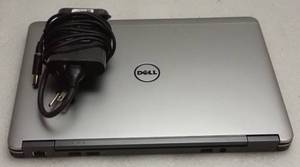 lot 34 image: Dell Latitude E7240 Notebook &nbspINTEL(R) CORE(TM) I7-4600U CPU  2.10GHZ  8GB RAM  256SSD  12.5 1366 x 768  Vent Grates on Bottom Slightly Cracked  NO OS  Includes Power Adapter