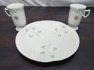 lot 73 image: Two Royal Tara Mugs and a Belleek plate