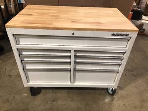lot 25 image: Husky 46 in. W x 51 in. D Standard Duty 9-Drawer Mobile Workbench with Solid Top Full Length Extension Table in Gloss White, Review all pictures, Customer return