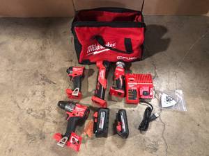 lot 31 image: Milwaukee 3698-24MT 18V Fuel 4-Tool Cordless Combo Kit  with 2 Batteries, Customer return, Review all pictures