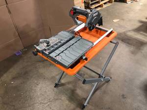 lot 25 image: RIDGID 9 Amp Corded 7 in. Wet Tile Saw, Customer return, Review all pictures
