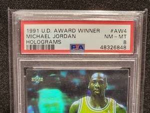 lot 29 image: 1991 Upper Deck Michael Jordan Hologram NM-MT PSA 8 Card #AW4