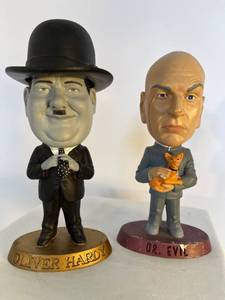 lot 11 image: Oliver Hardy and Dr. Evil figurines