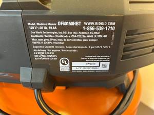 lot 66 image: 6-gallon Rigid Air Compressor on rolling stand with attachments & manual - used once