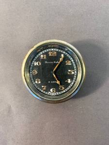 lot 75 image: antique Phinney Walker clock from a Model T