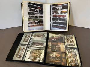 lot 107 image: 2 high-end leather photo albums (one Brooks Bros made in Italy the other embossed cowhide) of train photos