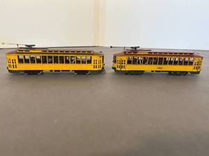 lot 110 image: two boxed NorthWest Short Line - Twin City Lines model trolleys, two light poles  train bridge