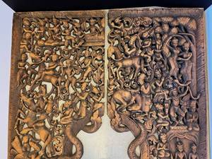 lot 4 image: two elaborately carved antique teak panels from Daytons flagship store