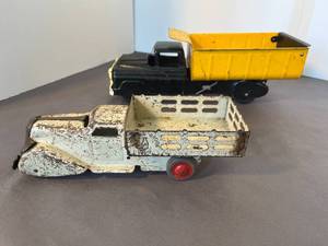 lot 5 image: two Marx trucks  a dump truck and a dairy truck,1950s & 1930s