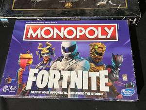 lot 34 image: Monopoly Board Games - Star Wars - Fortnite New in Package