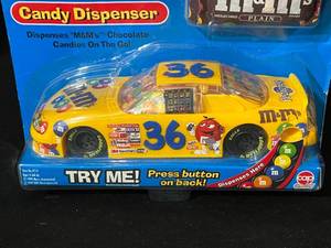 lot 72 image: M & M Racing Car Candy Dispenser - New in Package