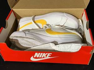 lot 150 image: Nike WhiteYellow Shoes
