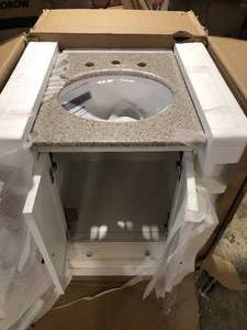 Home Decorators Newport 25 in. W x 21.5 in. D Bath Vanity in Ivory with Granite Vanity Top in Champagne with White Sink damaged see pictures