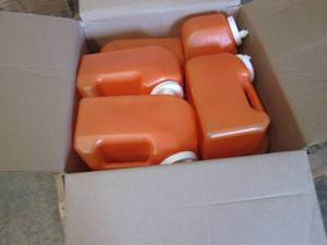 lot 29 image: Box of Amber Graduated 24 Urine Jug...