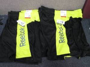lot 85 image: 4 Reebock 9 inch Slim Athletic Shor...