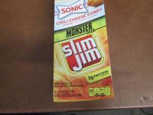 lot 421 image: Box of 18- 1.94 oz Slim Jim Monster...