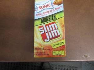 lot 423 image: Box of 18- 1.94 oz Slim Jim Monster...