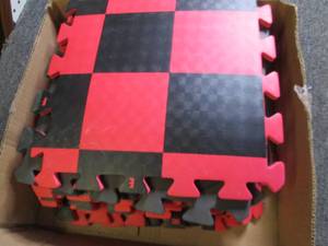 box of interlocking padded tiles ...