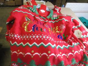 box of overstock christmas sweaters...