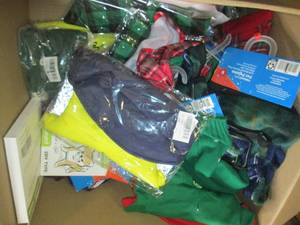 box of overstock dog clothes and mo...