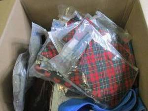 box of overstock pet clothes and mo...