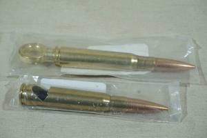 lot 221 image: Lucky Shot 50 Cal BMG Bottle Opener and Corkscrew
