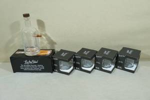lot 234 image: Lucky Shot Decanter and Rocks Glasses with Embedded Bullets
