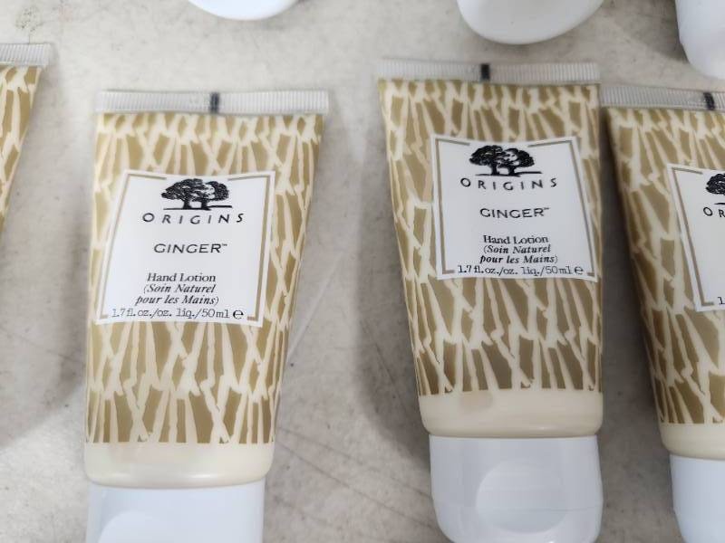 lot 153 image: 10 New Origins Ginger Hand Lotions