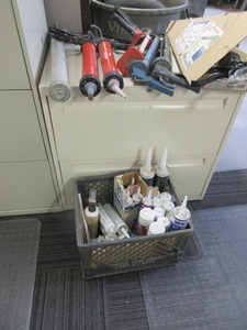 lot 213 image: CAULK GUNS AND CAULKING