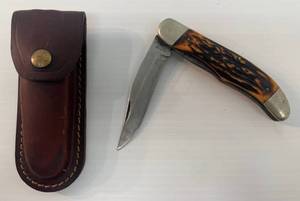 lot 108 image: Camillus Folding Pocket Knife With Kabar Leather Sheath