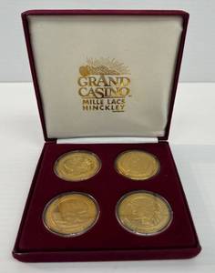 lot 127 image: Set Of Four Grand Casino Wildlife Coins In Box