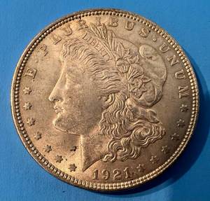 lot 131 image: 1921 Morgan Silver Dollar No Mint Mark In Plastic Protector