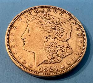 lot 133 image: 1921 D Morgan Silver Dollar In Plastic Protector