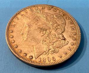 lot 136 image: 1896 Morgan Silver Dollar No Mint Mark In Plastic Protector