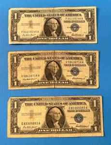 lot 140 image: Three 1957 United States One Dollar Silver Certificates